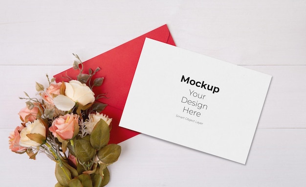 Valentine day greeting card mockup and letter and flower on wooden table