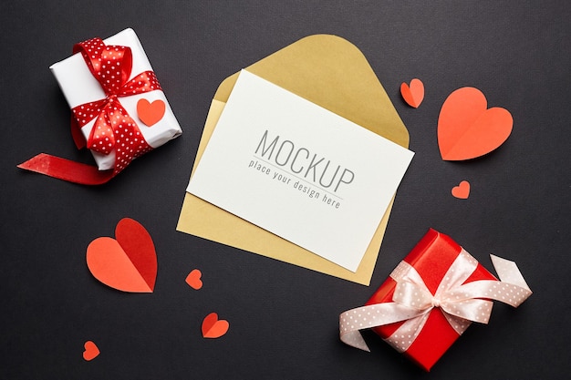 Valentine's day card mockup with envelope, red hearts and gift boxes paper