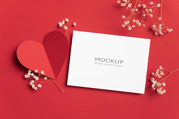 Valentines day flat lay with blank paper card mockup on red