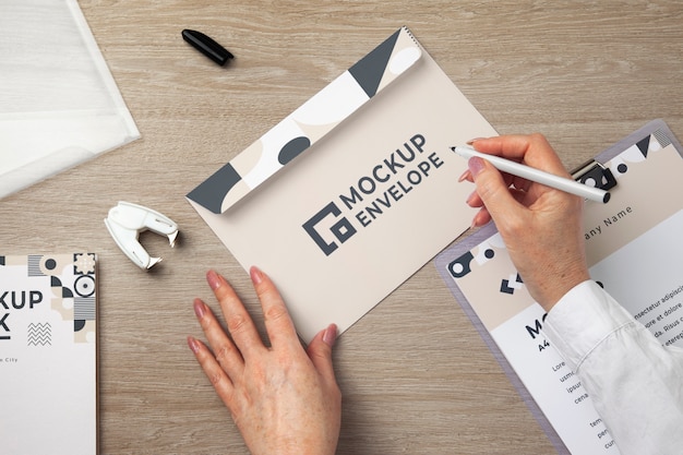 View of human hands holding paper document mock-up