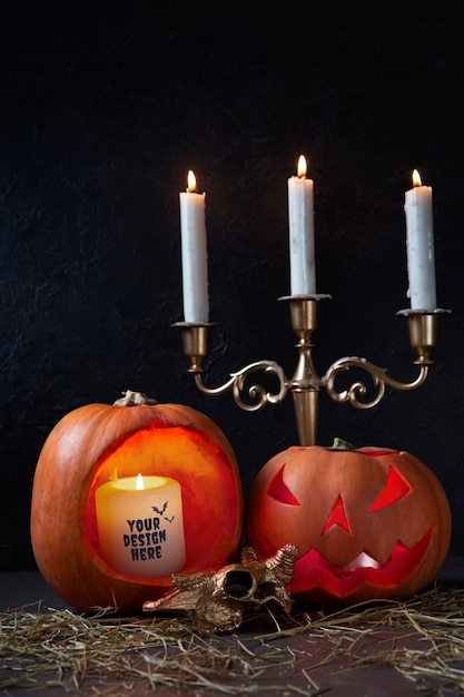 View of spooky halloween pumpkin with lit candle