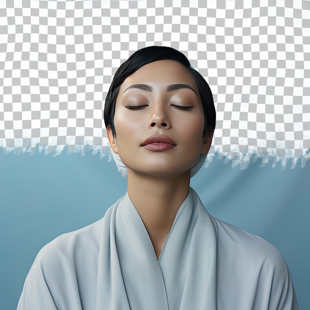 PSD a vindicated adult woman with short hair from the southeast asian ethnicity dressed in meditating for relaxation attire poses in a close up of lips style against a pastel blue background