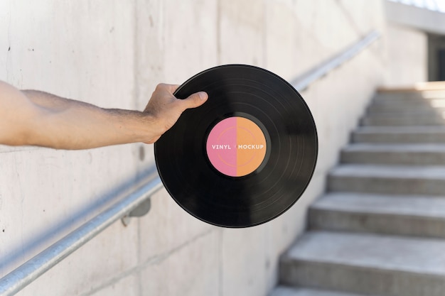 Vinyl record mockup held in hand