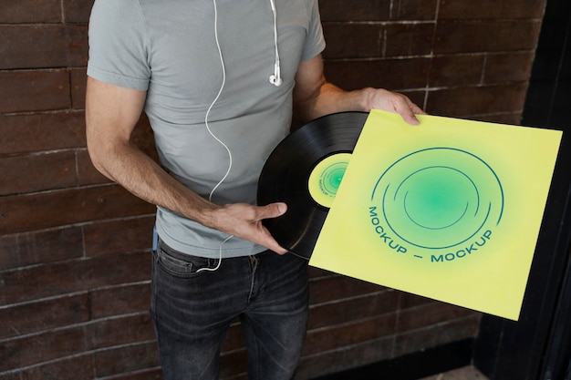 Vinyl record mockup held in hand