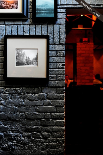 Wall poster mockup with black bricks wall