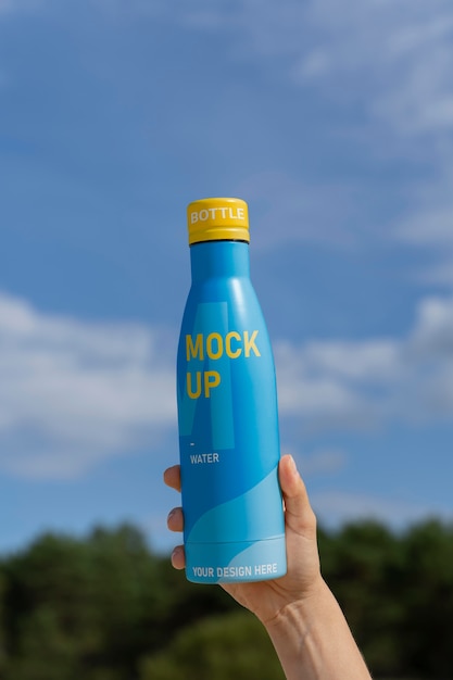 Water drop bottle mockup in nature