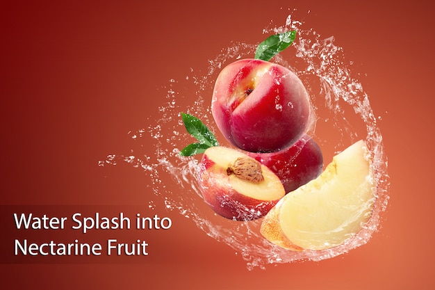 Water Splashing and fresh Nectarine fruit over red.