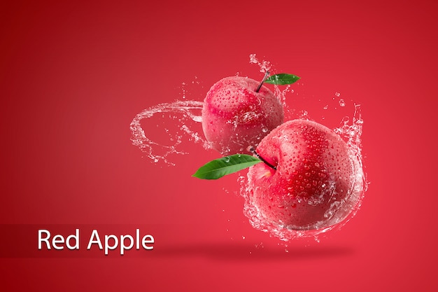 Water splashing on Fresh Red apple on red background.