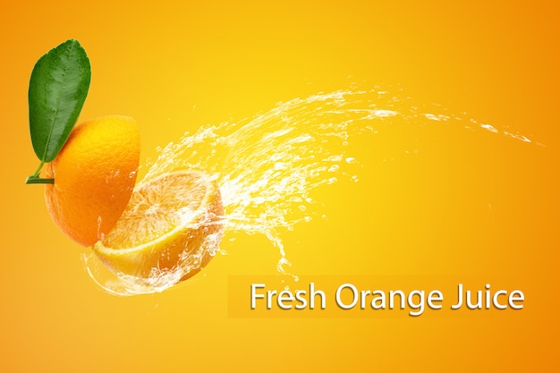 Water splashing on Sliced Orange over Orange background.