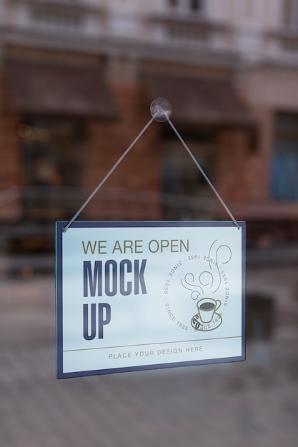 We are open sign mock-up hanging in the window