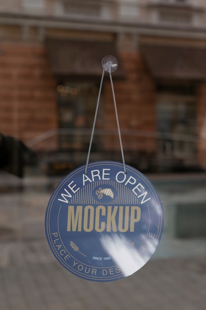 We are open sign mock-up hanging in the window