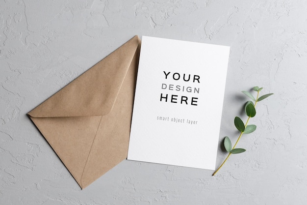 Wedding invitation card mockup with eucalyptus twig and envelope