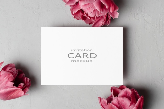 Wedding invitation card mockup with pink spring tulips flowers