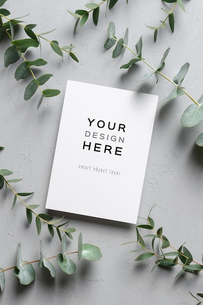 Wedding invitation or greeting card mockup with natural eucalyptus twigs