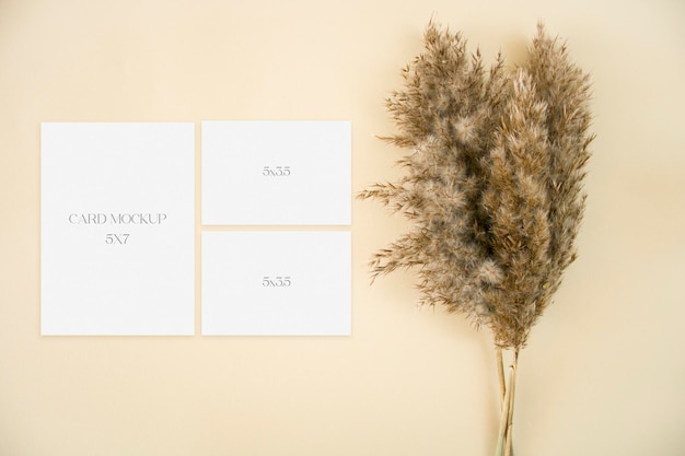 PSD wedding stationery set mockup with with pampas grass on beige background