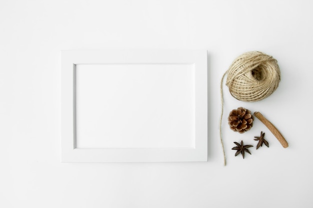 a white frame with a white frame and a hat on it