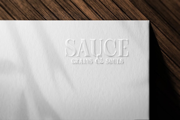 White Sauce Embossed Logo Mockup Template Design PSD