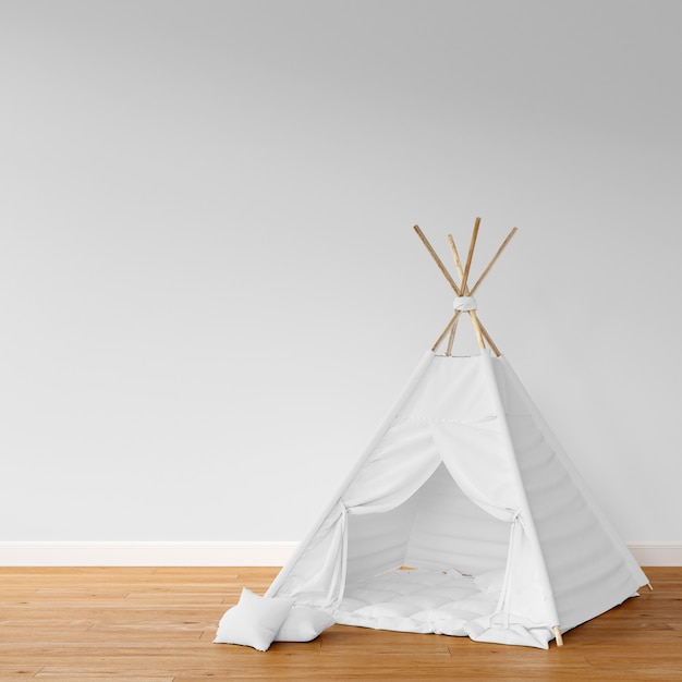 white teepee on wooden floor