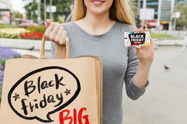 PSD woman in city with black friday bags