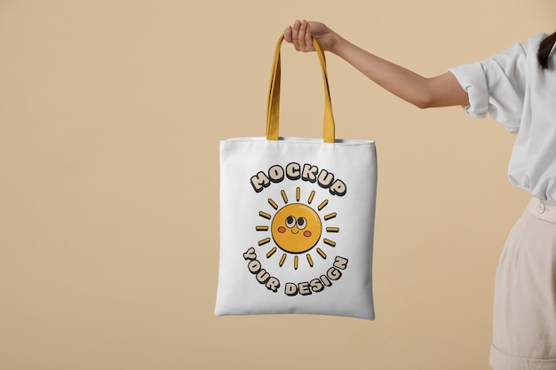 Woman holding beach bag mockup