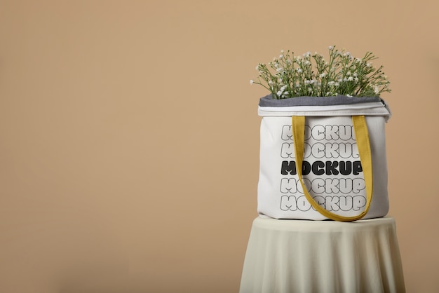 Woman holding beach bag mockup