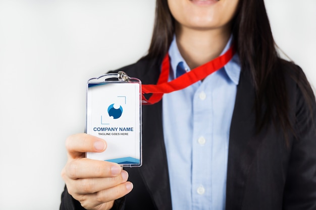 Woman holding id card mockup