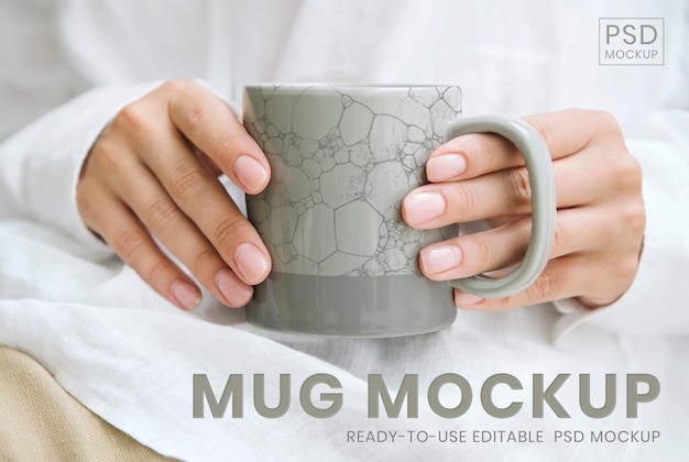 Woman holding a Japanese pattern coffee cup psd mockup, remix of