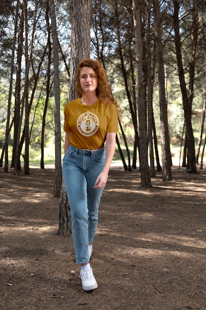 Woman outdoors in nature wearing t-shirt mock-up