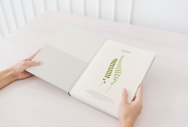 Woman reading a botanical book mockup 