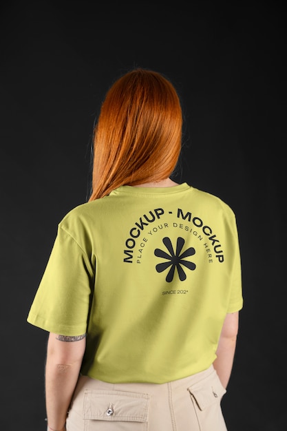 Woman showing back of t-shirt mock-up