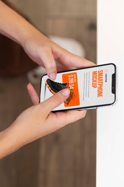 Woman using mock-up smartphone outdoors