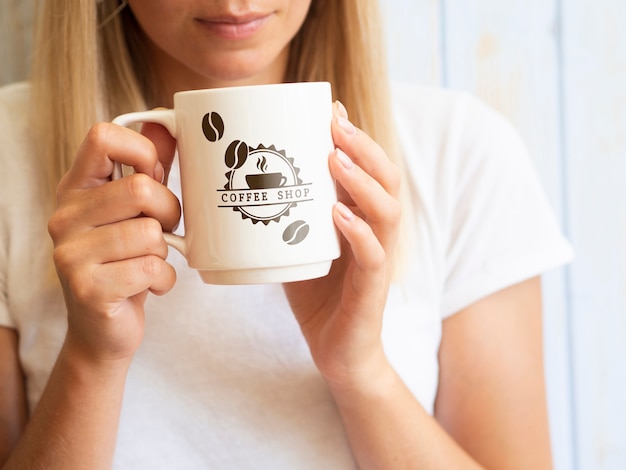 Woman wanting to drink from a coffee mug