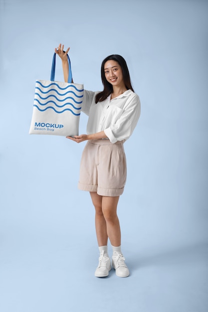 Woman wearing beach bag mockup