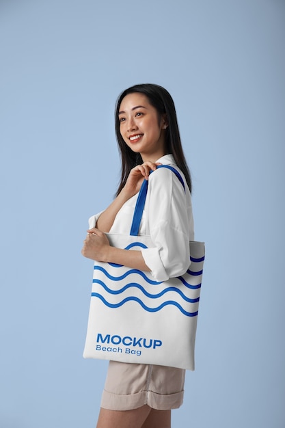 Woman wearing beach bag mockup