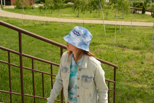 Woman wearing bucket hat mokcup