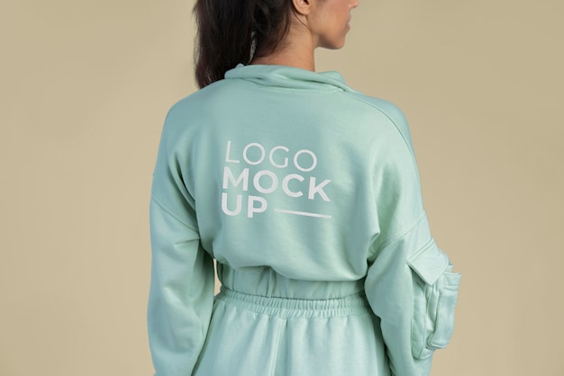 Woman wearing jogger pants and hoodie mockup