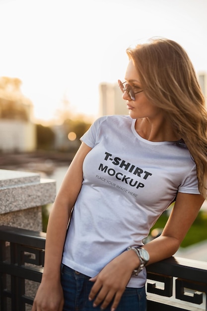 Woman wearing a tshirt mockup on a bench