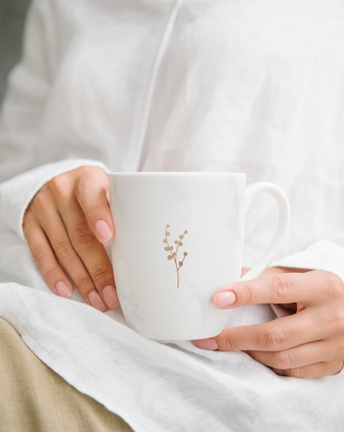 Woman with a coffee cup mockup