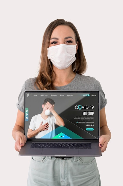 Woman with masks holding laptop