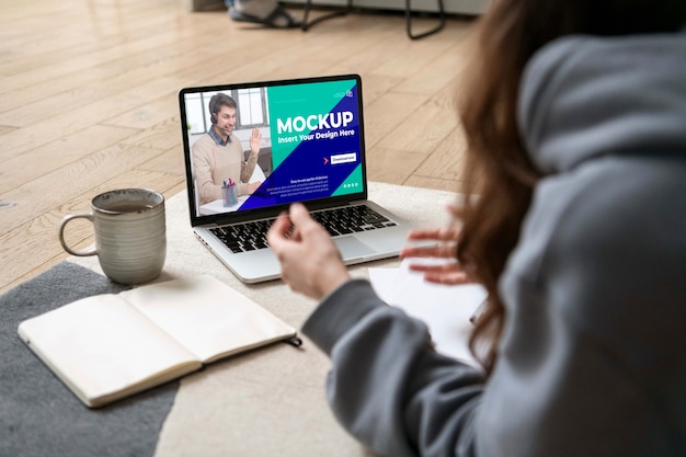 Woman working with laptop close up