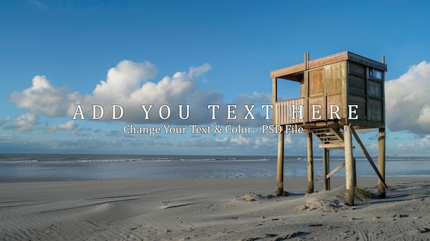 PSD wooden lookout tower on sandy beach with blue sky and clouds