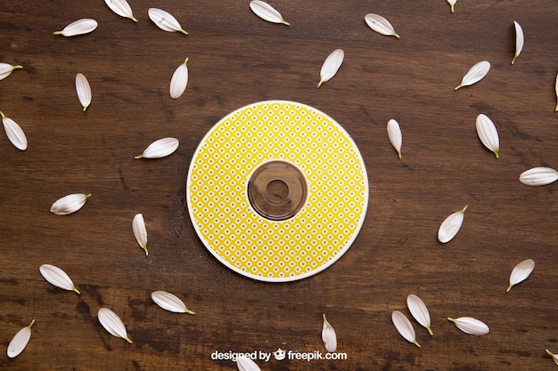 Yellow cd mockup with petals