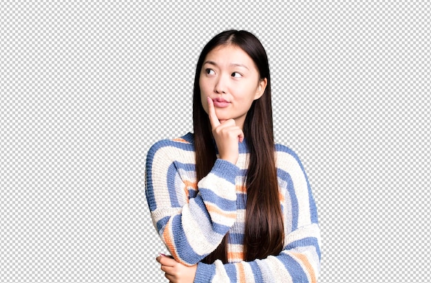 Young adult pretty asian expressive woman with a copy space to the side