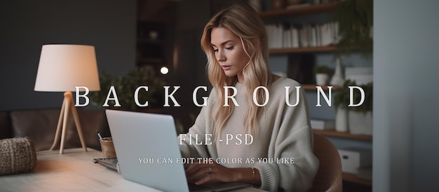 Young blonde businesswoman in front of computer looking at screen working on internet sitting at office desk