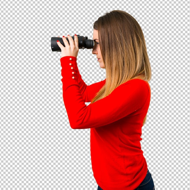 Young blonde woman with binoculars