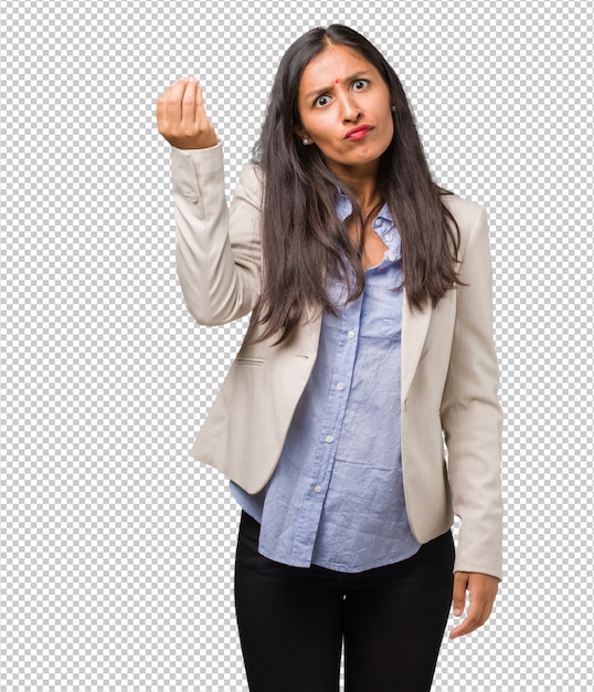 Young business indian woman doing a typical italian gesture, smiling and looking straight ahead, symbol or expression with hand