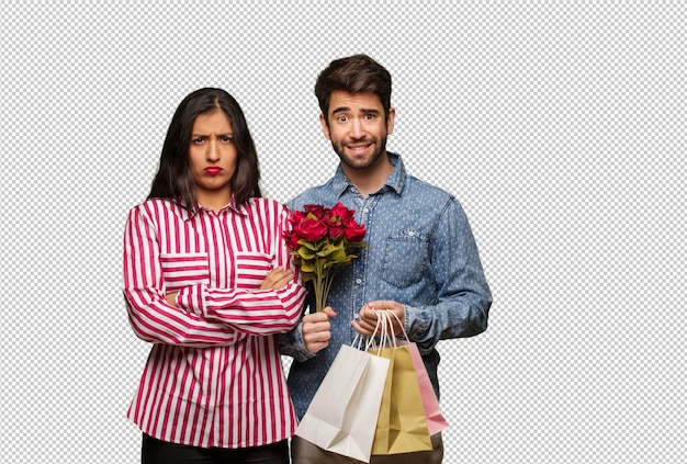 Young couple in valentines day crossing arms relaxed