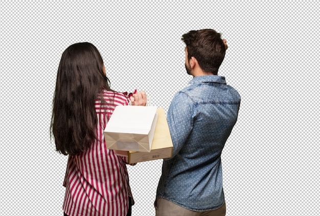 Young couple in valentines day from behind thinking about something