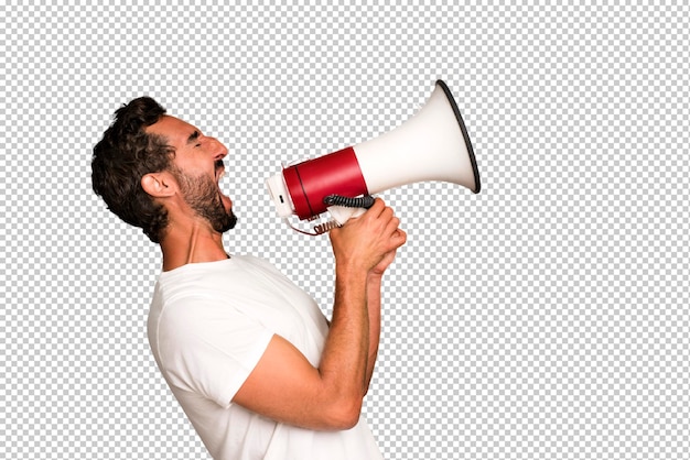 Young crazy bearded and expressive man using a megaphone to say a message