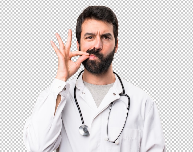 Young doctor making silence gesture